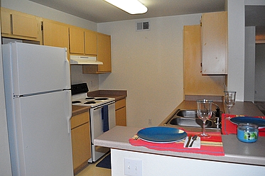 Our kitchens offer full size appliances and a bar for extra seating!